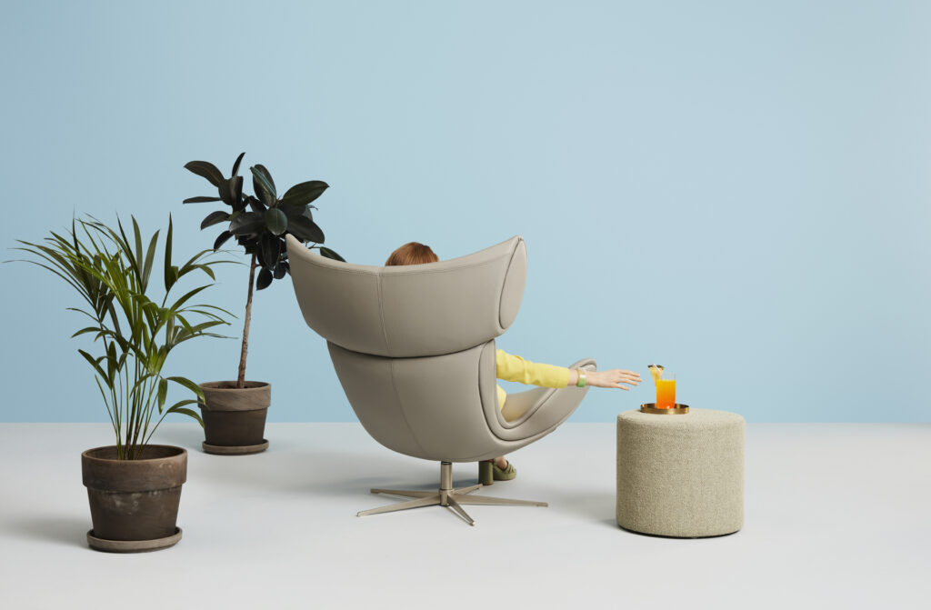 a person sitting in a BoConcept chair